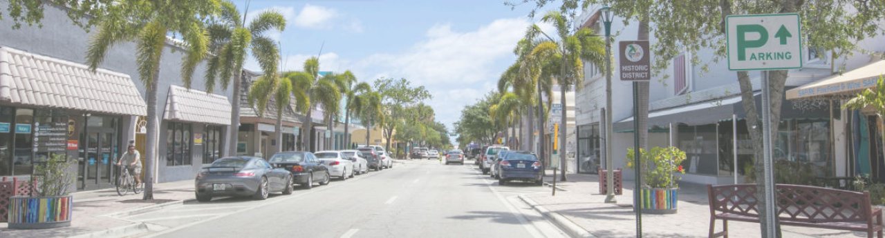 downtown parking study header with cars park sign.